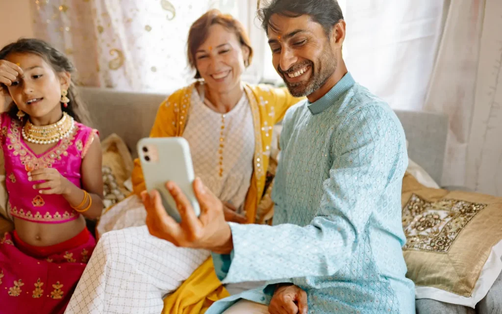Family reviewing a property project website together on a mobile phone