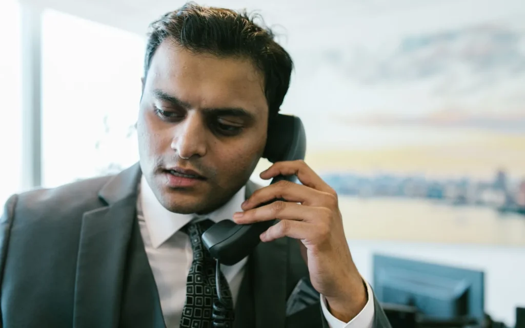 Business owner in Guntur reviewing new customer enquiries from their website